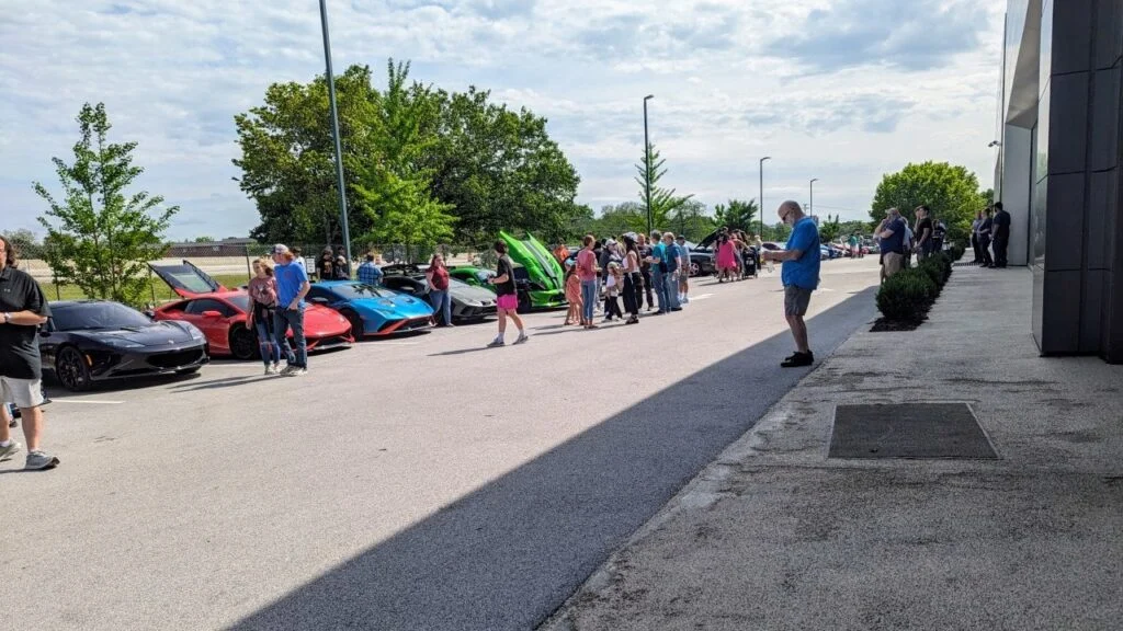 Porsches and pizza event spectators