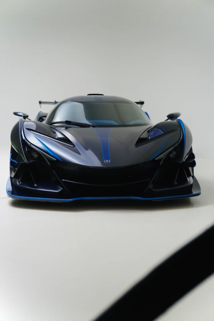 Black Apollo IE with blue accents front view in a studio setting