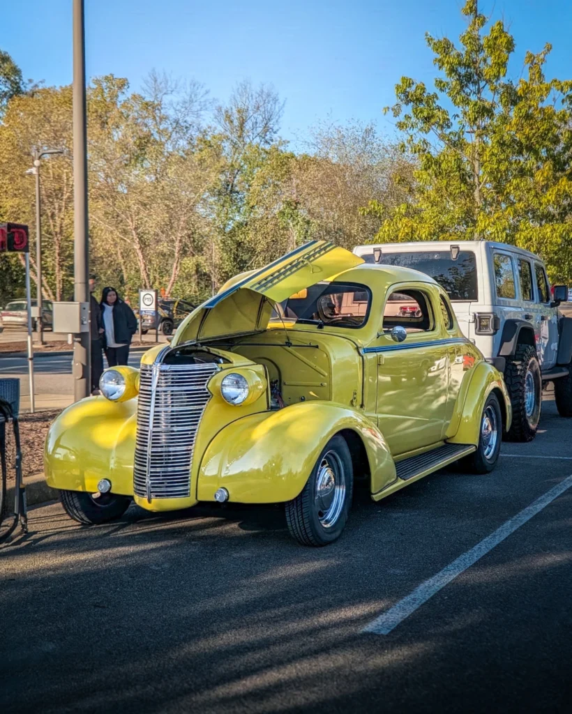 Yellow Chevrolet Master Deluxe Business Coupe with open hood